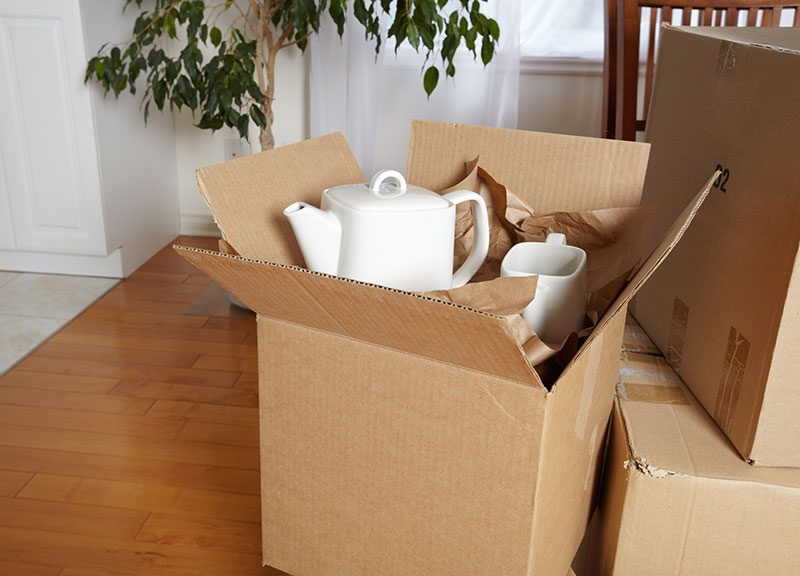 A moving box with tea supplies