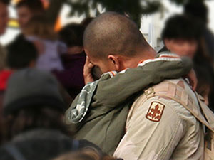 Military Family Reuniting with Hugs